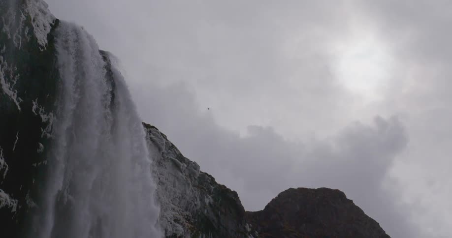 A waterfall on a cloudy day