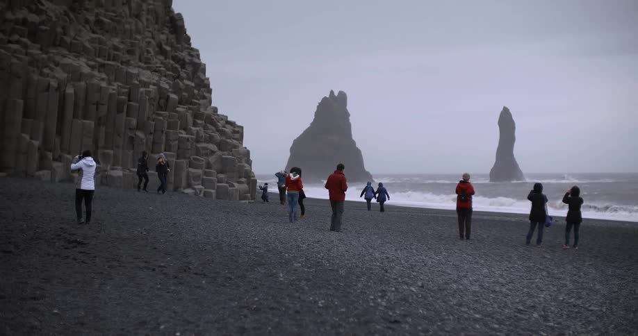 A group of people on a rocky beach