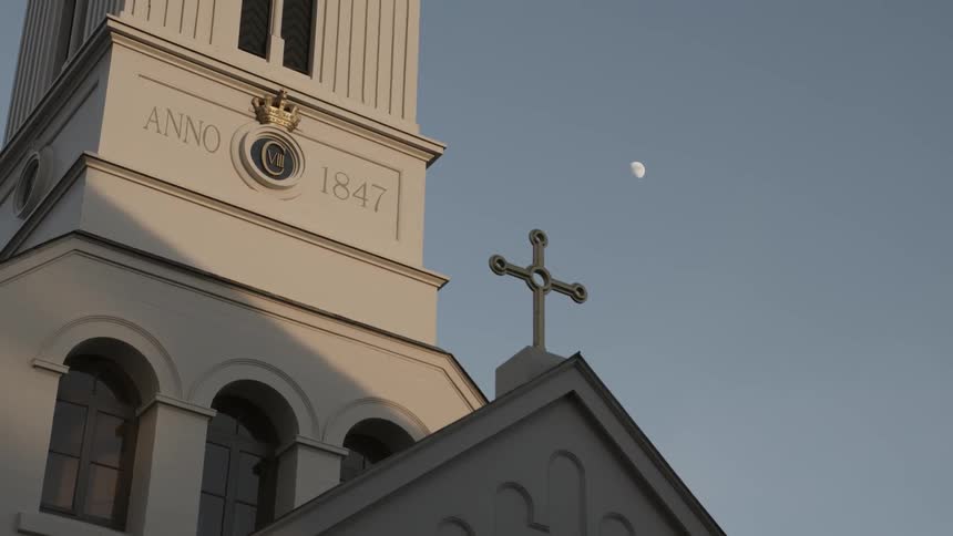 A church building dated 1847 towers into the sky