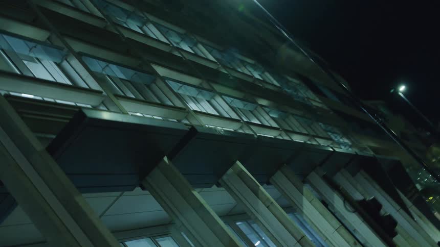 An empty office building at night filled with bright light