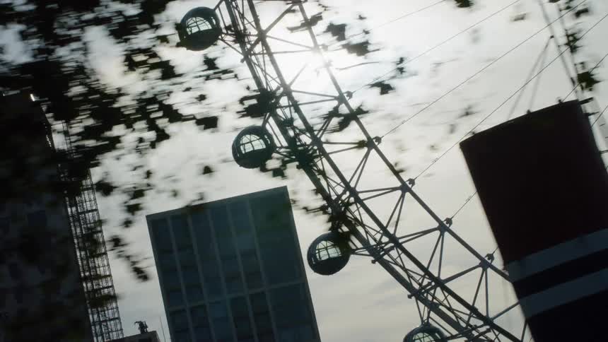 View of a metropolis with a ferris wheel