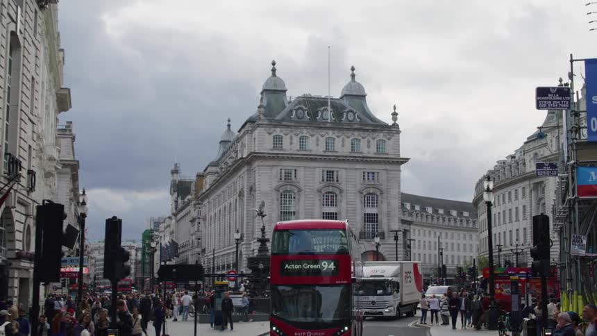A bus moves along a road in the city