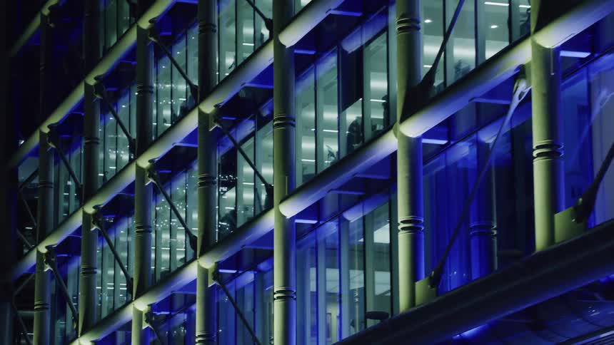 Iron and glass structure of city skyscrapers at night