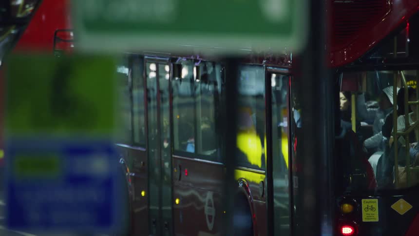 A bus drives through a city