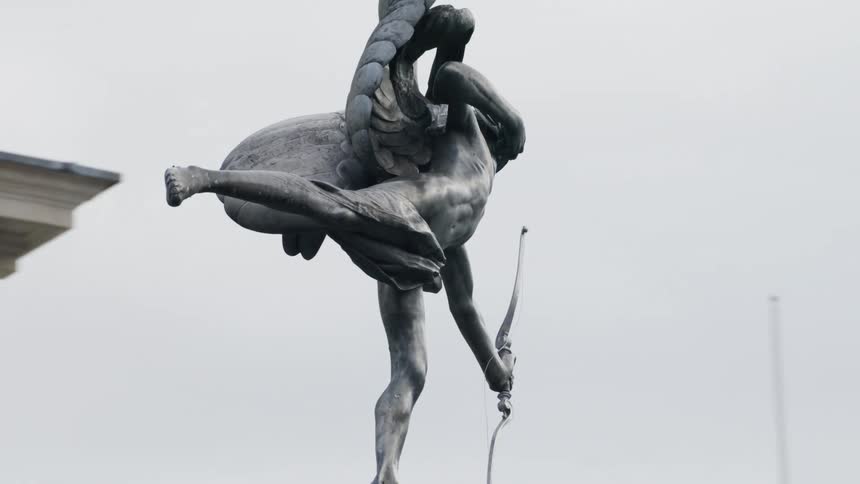 The statue is near the building