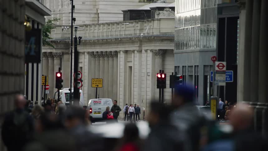 Crowds of people walk in the city
