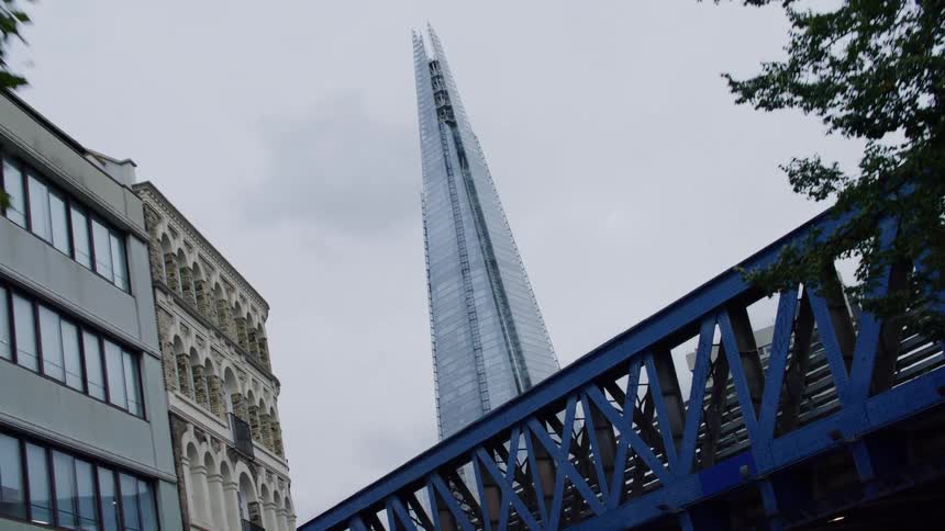 Looking at the shard in london then passing under a bridge
