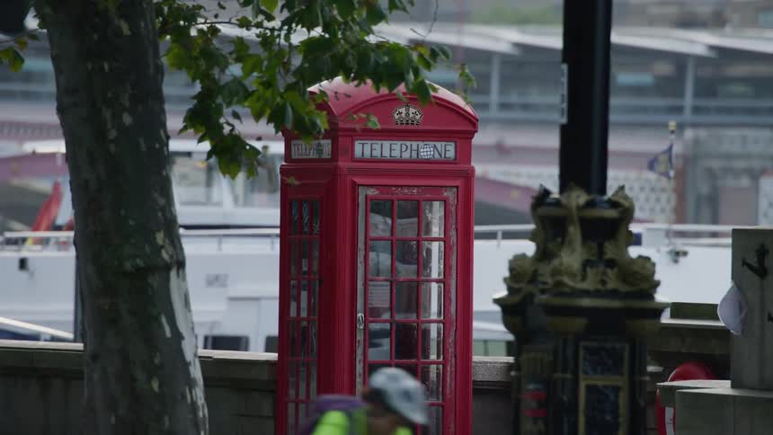 View of a telephone booth in the midst of the city of london