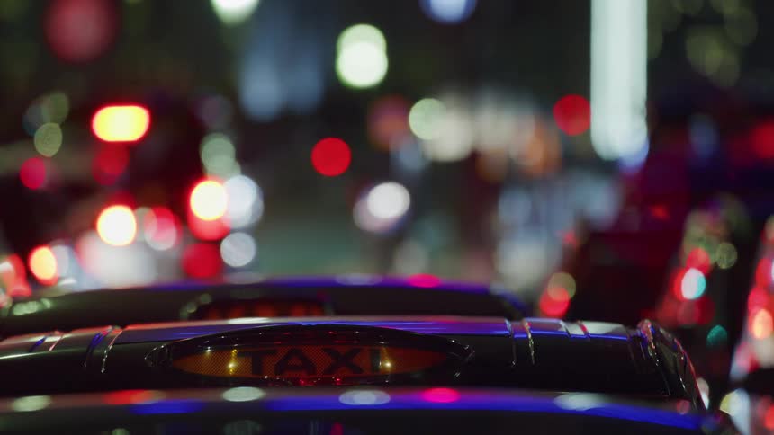 Traffic runs on the road at night