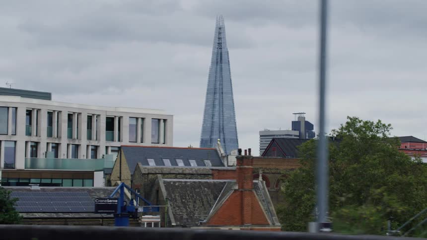 A london street with the shard in the background