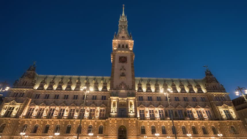 View of a tourist center building in a square at night