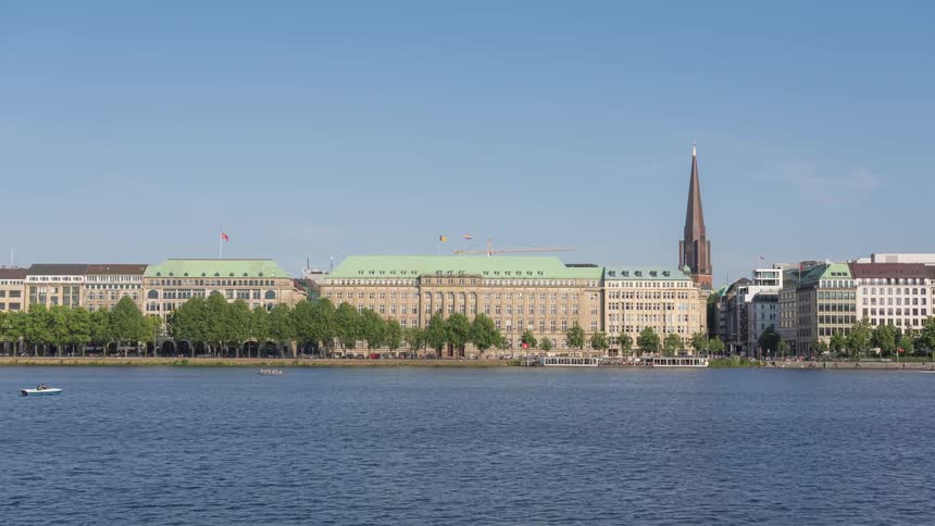 A river is close to the city with high rise buildings