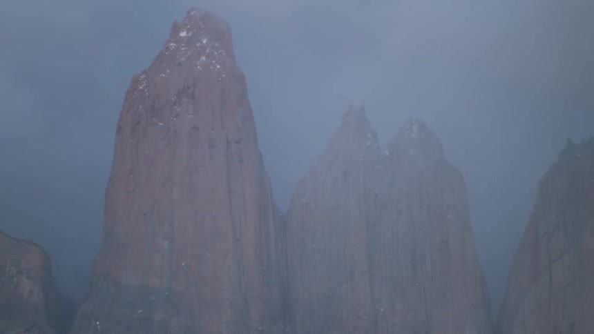 The fog and clouds flow over the mountains
