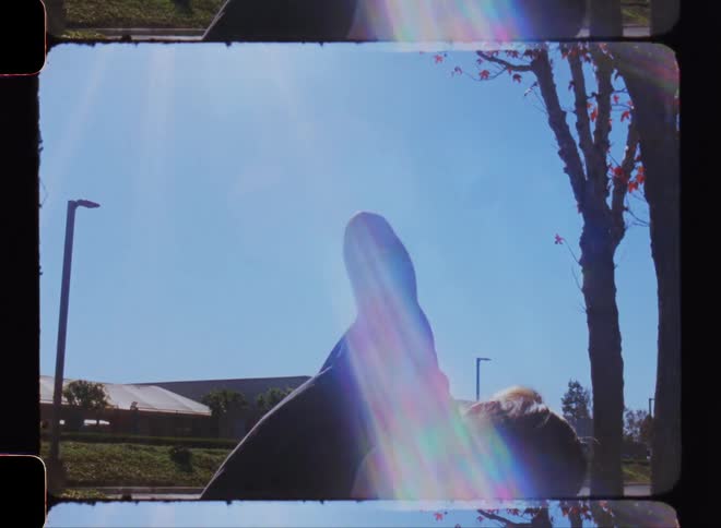 A man is dancing on a sunny day