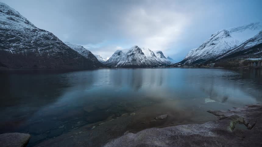 Waves move across a mountain lake