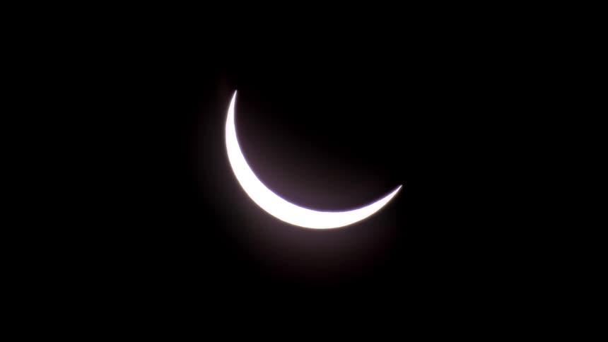 A crescent sun during total solar eclipse