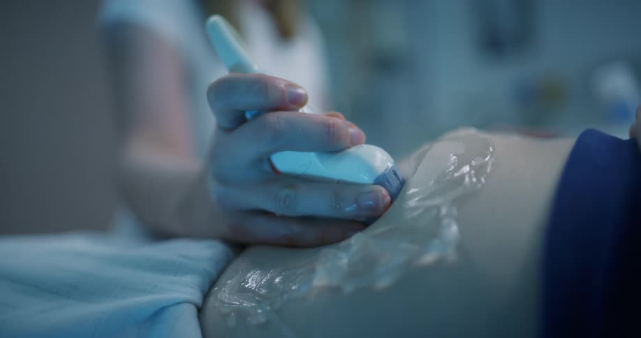 A woman is getting a sonogram