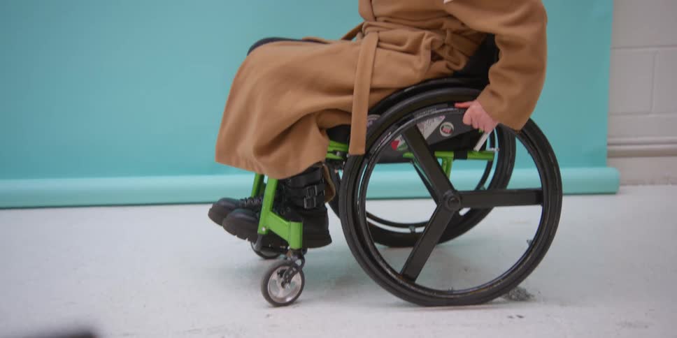 A person doing maneuvers in a wheelchair