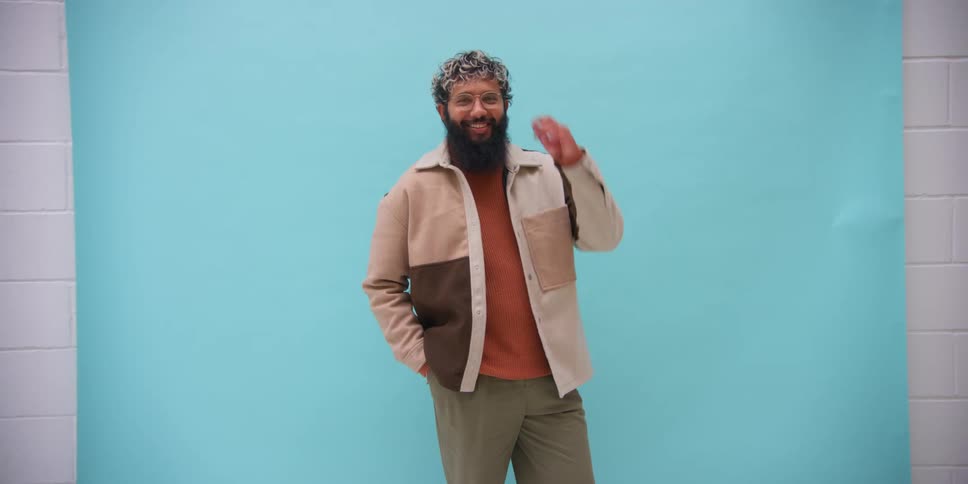 A man poses for pictures