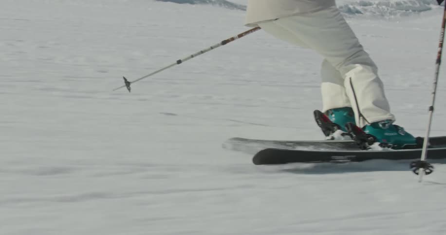 A person skiing down on a slope