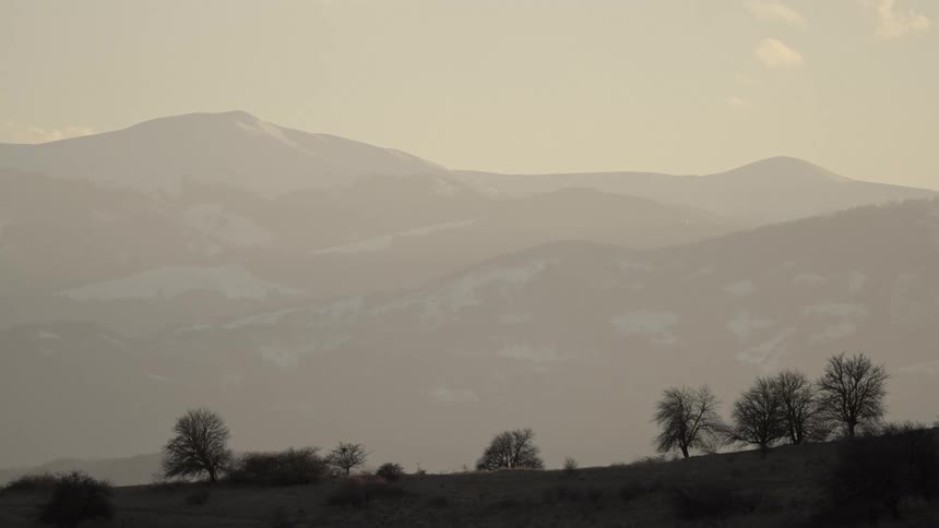 The mountains are covered in heavy fog
