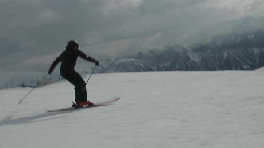 People skiing on the snow of a mountain during a harsh winter