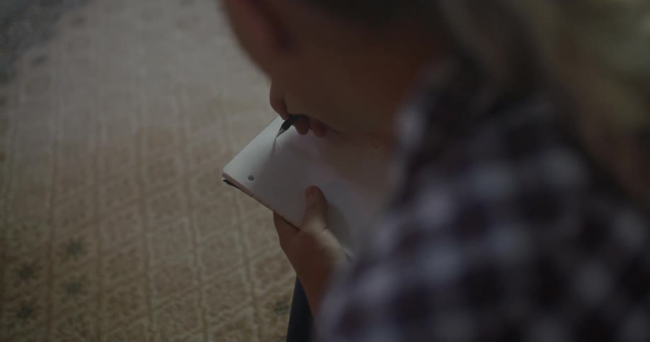 Woman writing in a notebook