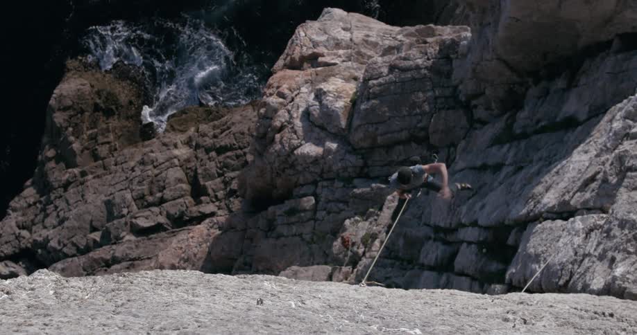 A mountain climber falls from a cliff
