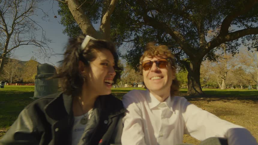 Two people a boy and a girl playing and laughing together