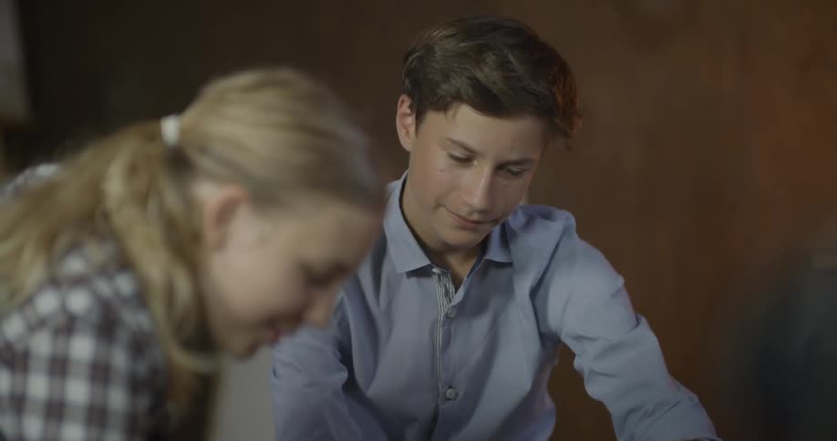 A young boy and girl laugh