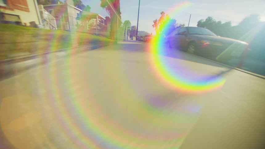 Speeding down a suburban sidewalk at ground level