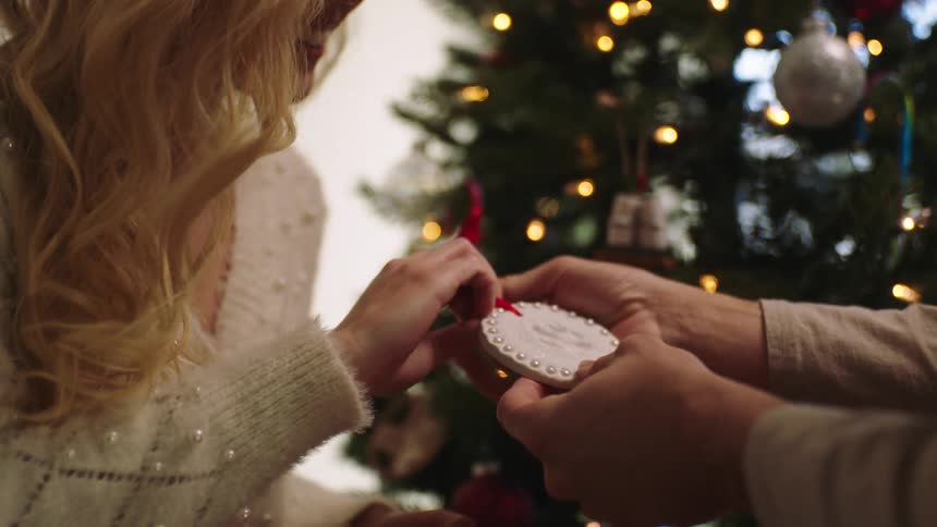 A clip of a lady gifting a man