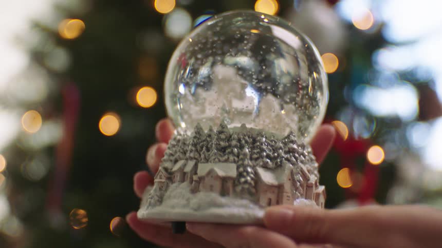 Snow falls in the snow globe