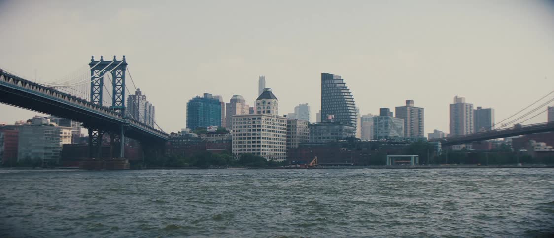 A city skyline beyond a river