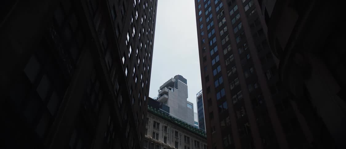View upwards of buildings on a cloudy day