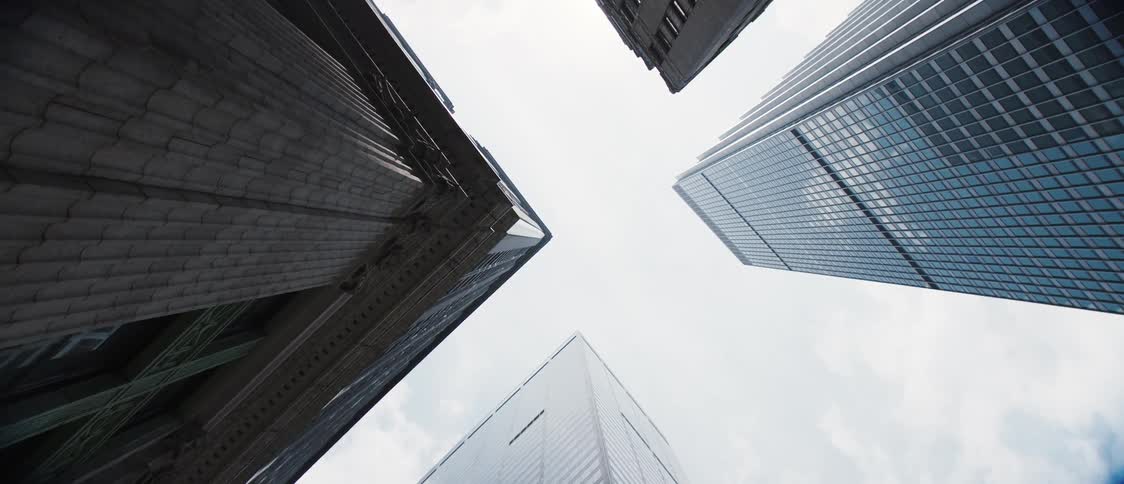 Upward view with skyscrapers on a cloudy day