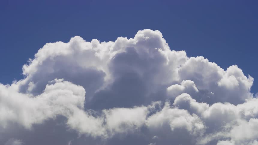 A clear sky with a large group of white clouds
