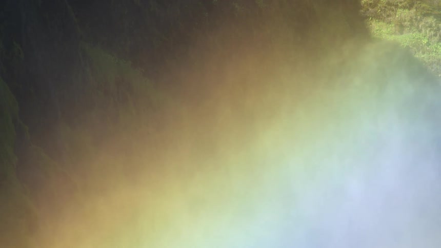 A smoke of water vapor making a colorful rainbow