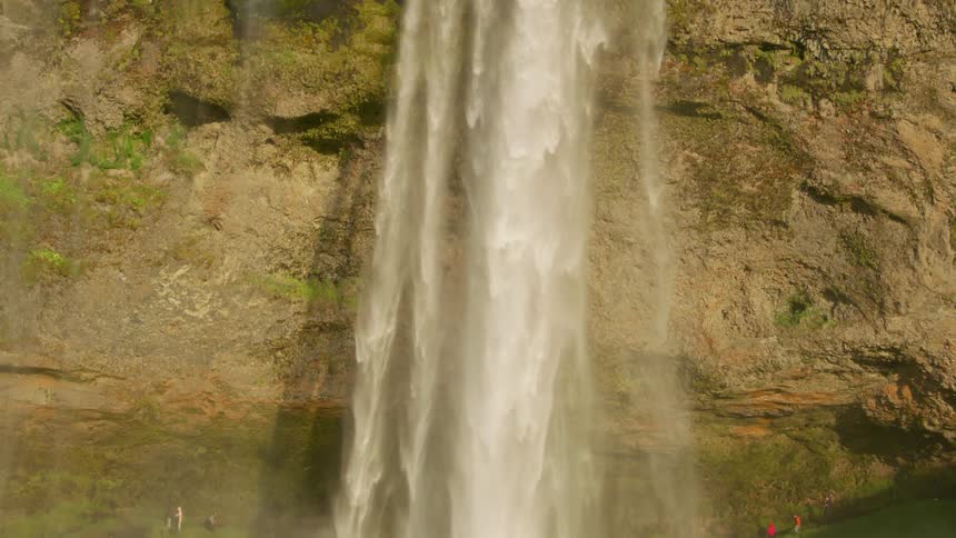 Huge freefalling waterfall on a cloudless blue day