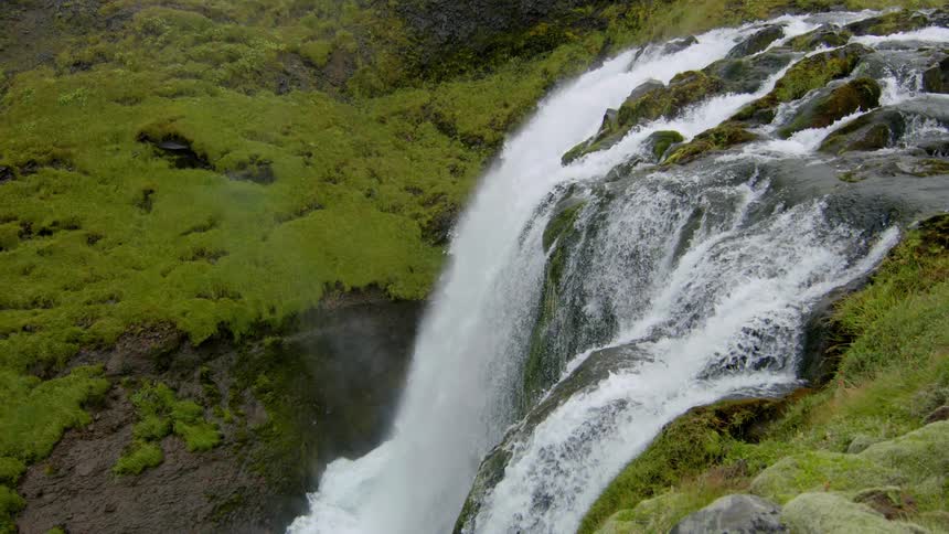 The stream falls into a small waterfall
