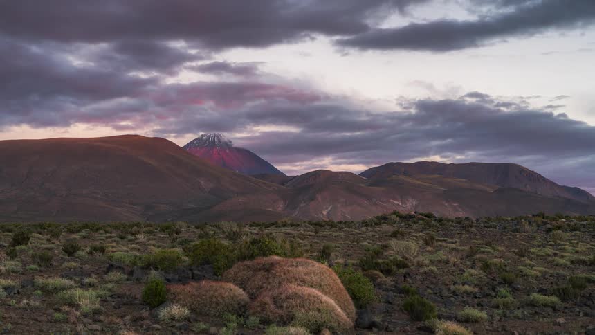 Landscape of mountains with the morning sky getting dark in timelapse