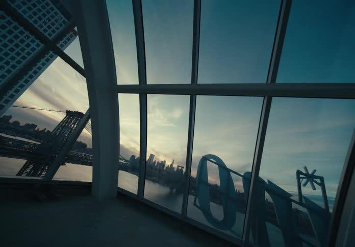 A view out the window of an office building at sunset