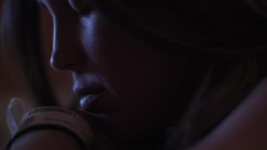 A young woman with eyes closed
