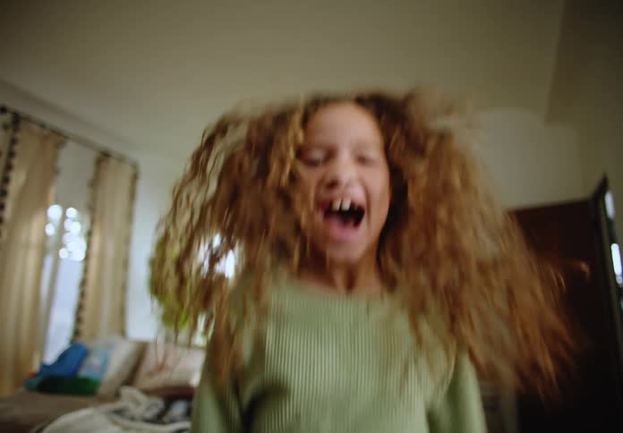 Portrait of a young little girl jumping smiling