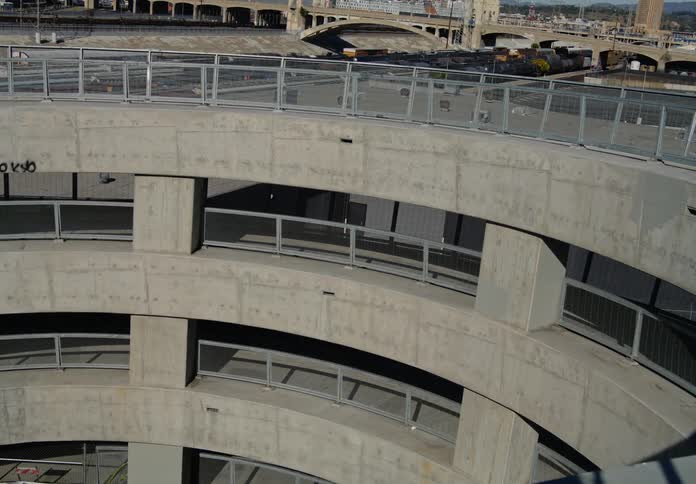 A woman running up the ramps of a parking garage