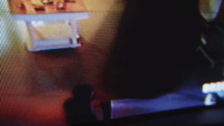 Video being played on the monitor of a thief entering an establishment