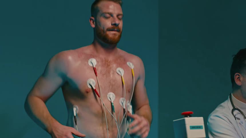 A doctor monitors a patients fitness test