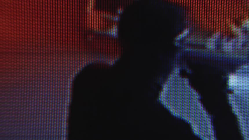 Video from a camera of a man inside an establishment with a metal bicycle sample