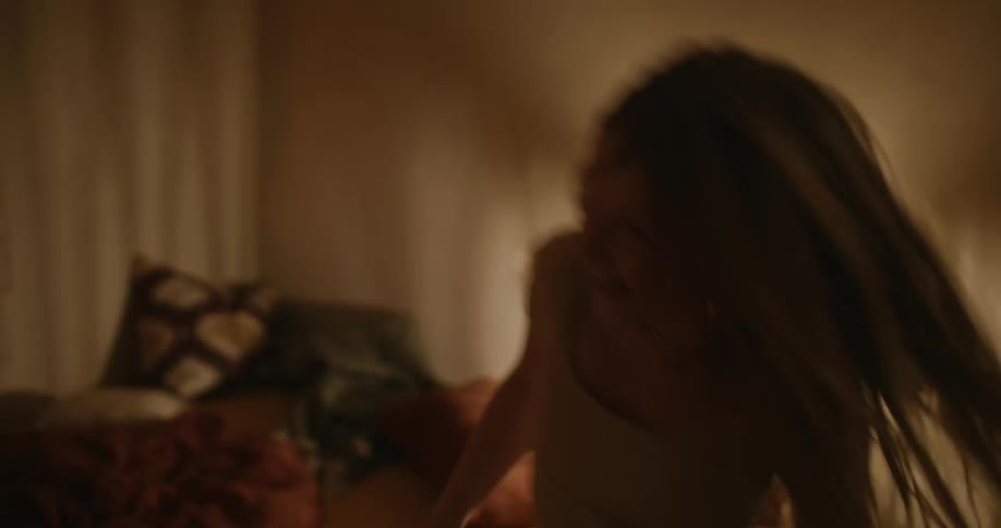 Two girls dance together in the bedroom