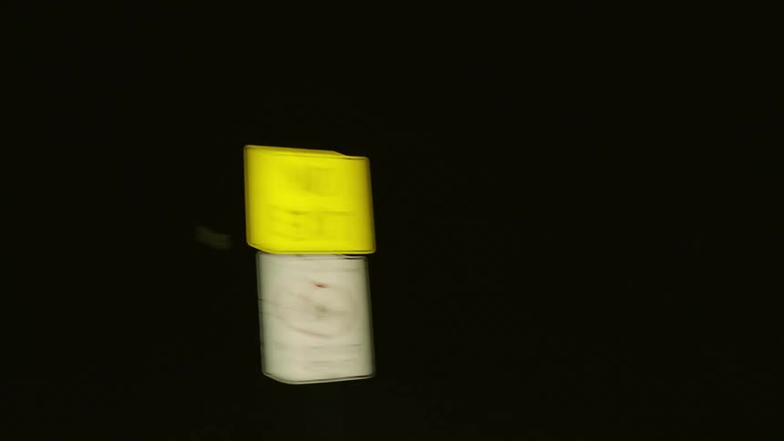 Road signs on a deserted road at night